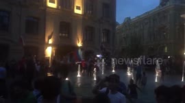 Overjoyed Russian fans jump into fountain after win over Spain