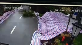 CCTV shows moment road collapses in residential area in China