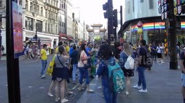 Brazil football fans partying in the street by Leicester Square after team wins game against Mexico 2-0