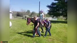 Brave equestrian who had three limbs amputated due to rare condition gets back in the saddle for the first time