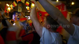 England fans waving St George's flag sing 'Don't Take Me Home' after shootout win