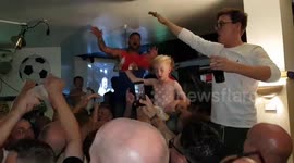England fans dance on the tables to 'Three Lions' after shootout win
