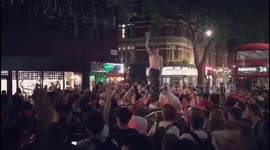 Shirtless fan in London jumps atop car after last-16 win against Colombia