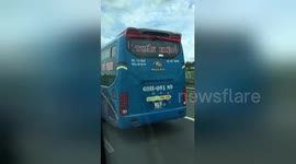 Newsflare Edit - Reckless bus driver caught steering packed coach with his FEET