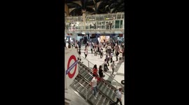 Flashmob in London Station - England football fans celebrate World Cup win
