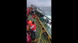 Indonesia ferry tragedy footage shows passengers clinging to side of vessel