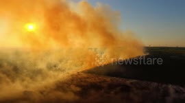Drone captures eerie sight of Northern Ireland wildfire during sunset