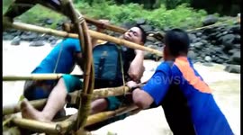 World's most dangerous school run! Kids cross flooded river in a bamboo basket