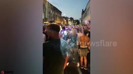 Football hooligan jumps on top of police car during England World Cup celebrations