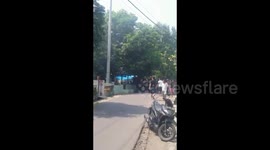 panicked residents running around to see the bomb explode,