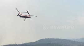 Massive helicopter fills bucket with 2,500 gallons of water to fight Colorado fire