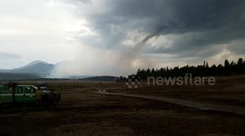 Tornado moves through Colorado brush fire in rare weather phenomenon