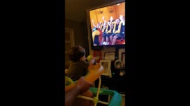 Dad simulates rollercoaster ride for baby daughter in walker