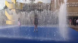Fun in the water fountains on a hot Summer day in Southbank London