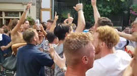England fans celebrate victory over Sweden outside London's Shard