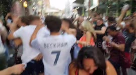 England fans celebrate beating Sweden in the World Cup outside London Bridge