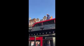 Celebrations on the bus and bus stop roof - celebrating win over Sweden