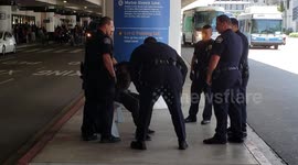 Lax airport police on  a 390 homeless man cops give him water and let him go at Los Angeles  Airport
