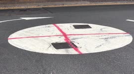 England flag spray-painted on roundabout