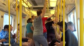England fans celebrate victory singing on the tube