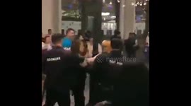 Moscow police detain girl for painting fans' faces