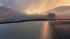 Fast-moving brush fire burns scarily close to California interstate
