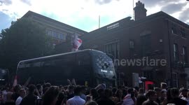 Football fan scales bus after England’s quarter final win