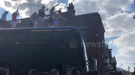Football fans scale bus after England’s quarter final win