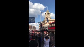 Jubilant fan crashes through roof of bus stop after England win