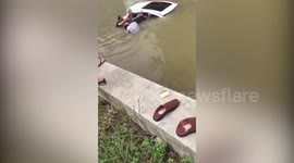 Good Samaritans rescue people trapped in car that fell in river