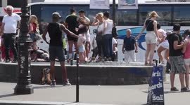 Parisians use train air vents to cool down in sweltering summer heat