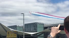 Stunning aerial display of Red Arrows flying over Heathrow Airport