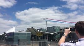 Stunning aerial display of Red Arrows flying over Heathrow Airport