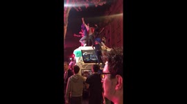 French fans light flares and climb atop buses during wild World Cup celebrations