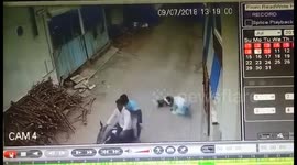 Woman fights back as two robbers drag her along road