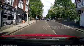 Cyclist rides around wheelchair user against a red light on crossing