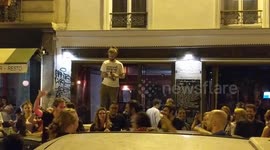 French football fan does splits on a car in semi finals World Cup celebration, rue Saint Maur, Paris, France