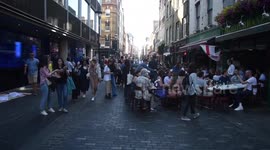 England supporters saunter and sing through Soho