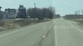 Car runs stop sign