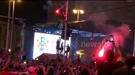 Flares light up Croatian night sky as fans climb lamp posts