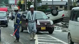 Footage shows overturned cars as death toll in Japan floods rises to 180