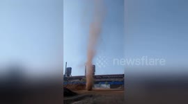 Huge dust devil swirls for minutes at coal factory in China