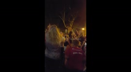 Croatian fans mounting a car while celebrating the victory in the semi-final match