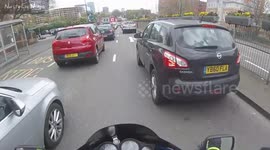 BMW Driver using a mobile phone and eating a burger