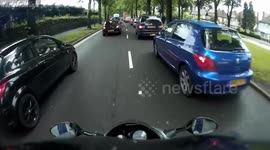 Car driver reading newspaper