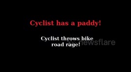 Cyclist has a paddy!  Cyclist throws bike ROAD RAGE!