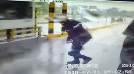 Extreme winds nearly knock toll-gate workers off their feet