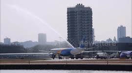 The all new Embraer E190 E2 gets a water cannon salute on its maiden arrival at London City Airport