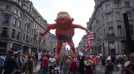 Giant Trump model seen towering over protesters in London