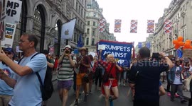 Parade of trumpeters play out of tune to protest Trump